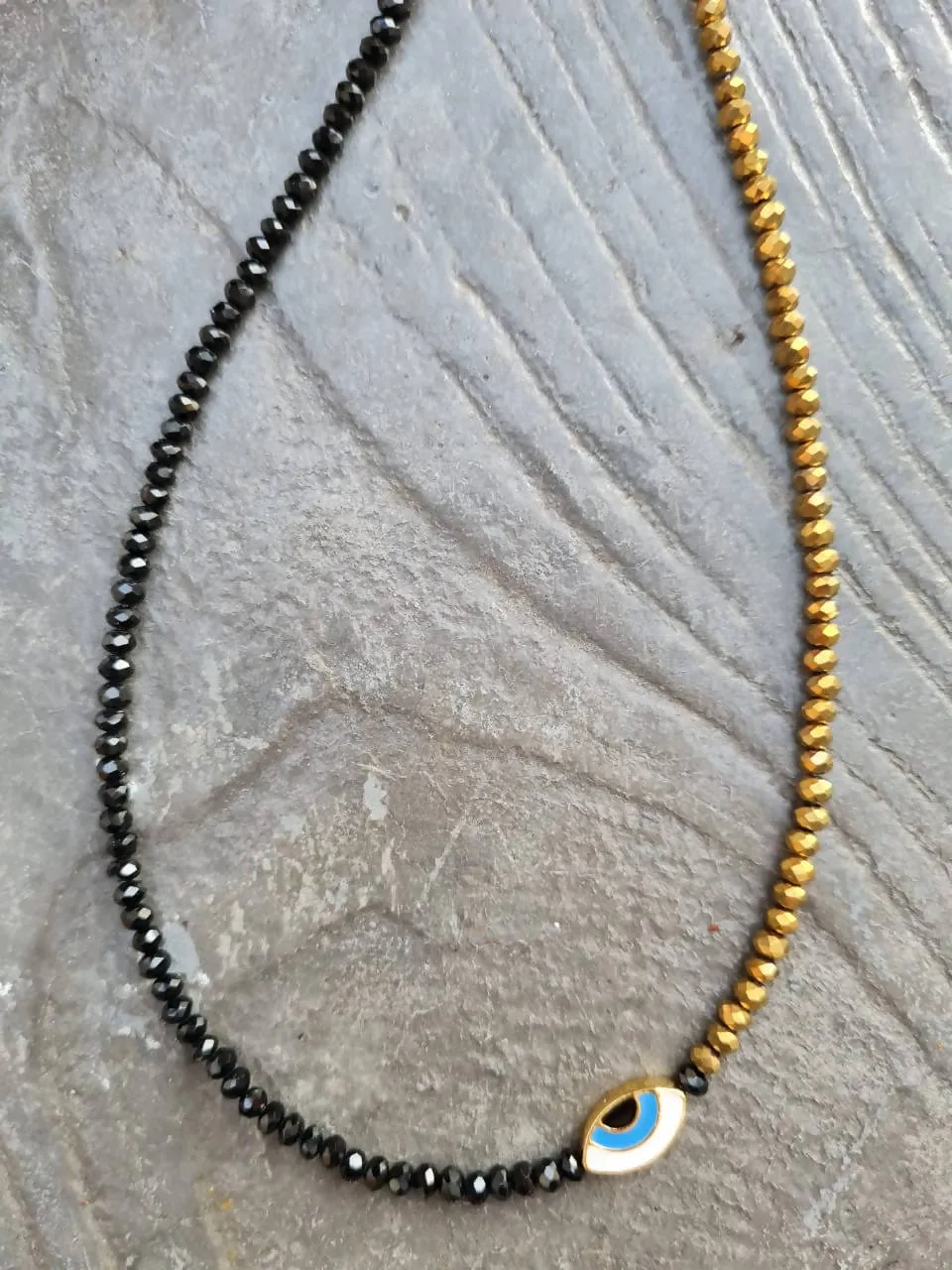 choker half black half gold with evileye